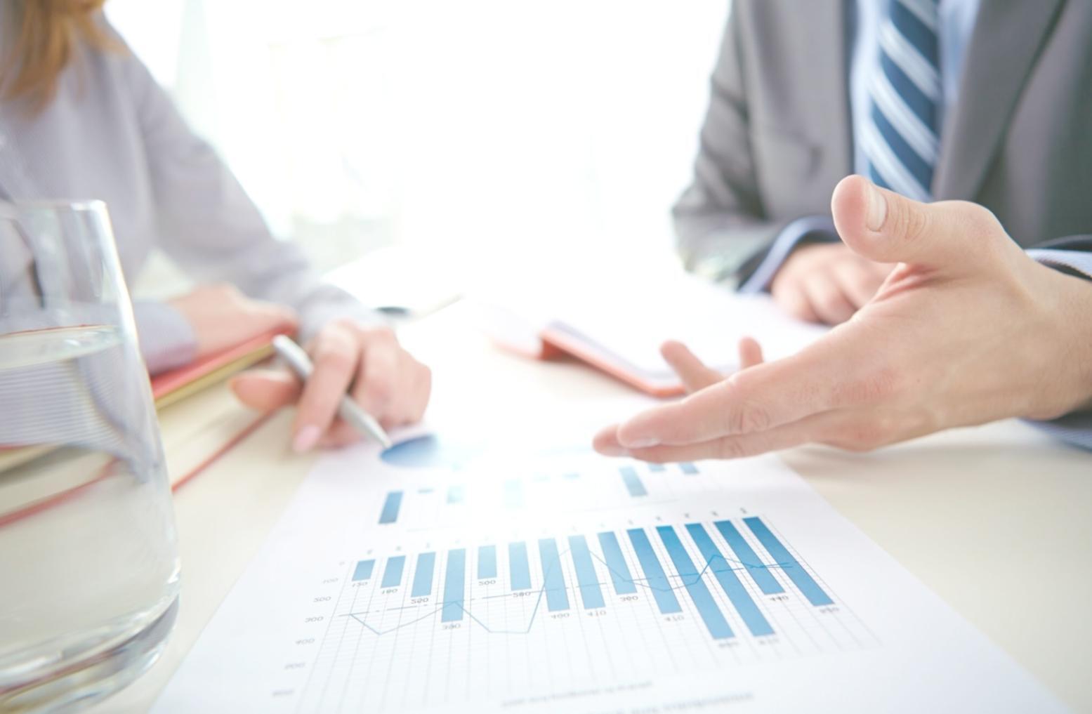 Strategic planning session with financial projections and business planning documents